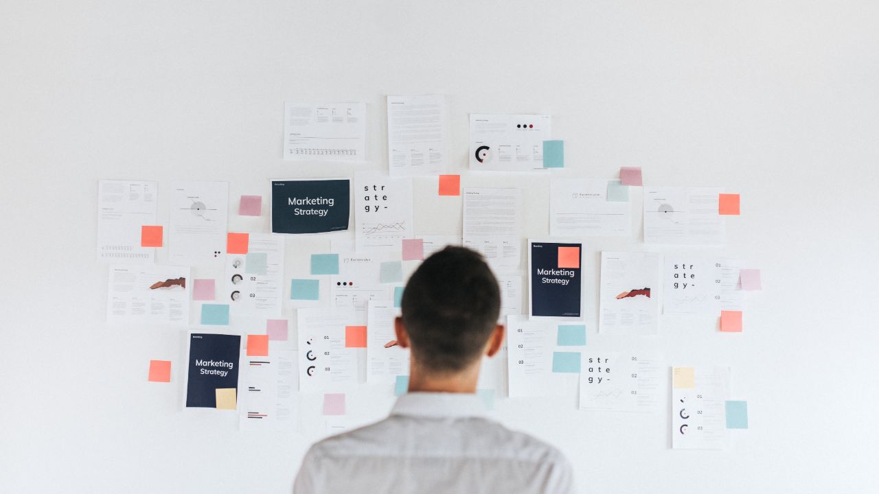 Man looking at content ideas on a wall